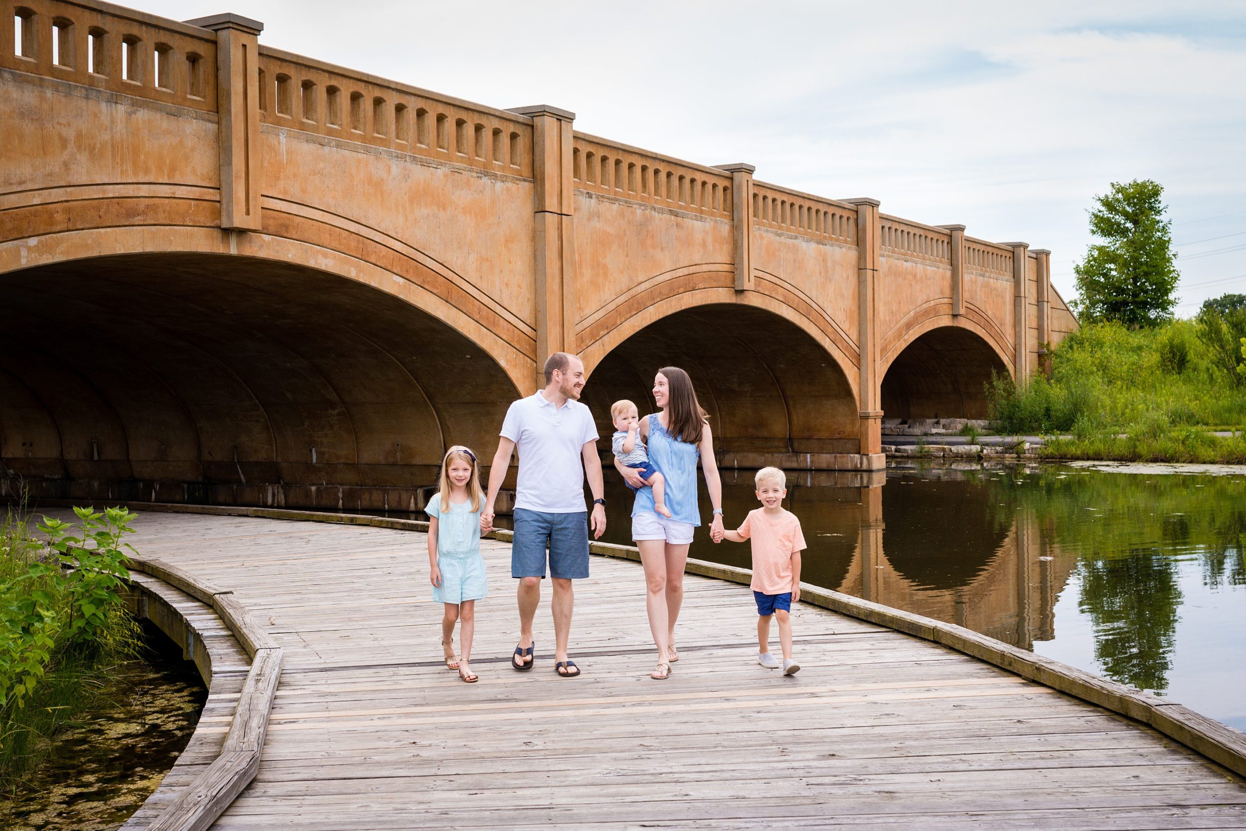 family walking on path at monon center carmel indiana photographer